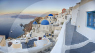 White houses and blue domes of the churches dominate the Aegean Sea Oia Santorini Cyclades Greece Europe