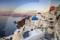 White houses and blue domes of the churches dominate the Aegean Sea Oia Santorini Cyclades Greece Europe