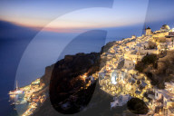 View of the Aegean Sea from the typical greek village of Oia at dusk Santorini Cyclades  Greece Europe