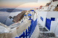 The last light of dusk before sunrise over the Aegean Sea seen from the typical village of Oia Santorini Cyclades Greece Europe