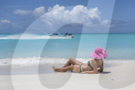 Tourist admires the turquoise Caribbean Sea, Jolly Beach, Antigua, Antigua and Barbuda, Leeward Islands, West Indies, Caribbean, Central America