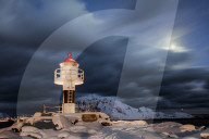 Lighthouse and full moon in the Arctic night with the village of Reine in the background, Nordland, Lofoten Islands, Arctic, Norway, Scandinavia, Europe