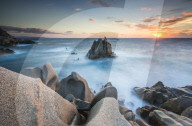 The light of sunset on blue sea framed by cliffs Capo Testa Santa Teresa di Gallura Province of Sassari Sardinia Italy Europe