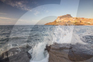 Waves of blue sea frame the village perched on promontory Castelsardo Gulf of Asinara Province of Sassari Sardinia Italy Europe