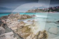 Storm clouds frame the village overlooking the turquoise sea Santa Teresa di Gallura Province of Sassari Sardinia Italy Europe