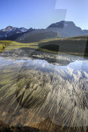 Peak Suretta is reflected in Lake Andossi at dawn Chiavenna Valley Spluga Valley Valtellina Lombardy Italy Europe