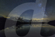 Stars and Milky Way illuminate the snowy peaks and Lac de Cheserys Chamonix Haute Savoie France Europe