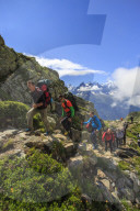 Hikers on the rocky paths around Lac De Cheserys in a sunny summer morning Chamonix Haute Savoie France Europe