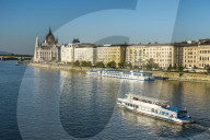 Little ferries on the Danube before the Panorama of Pest, Budapest, Hungary