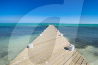 Long wooden pier in the turquoise waters of Providenciales, Turks and Caicos
