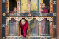 Young novis monks in the window of their quarters