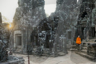 Monk sitting sitting in the Bayon temple, Angkor Watt