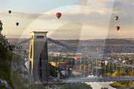 Clifton Suspension Bridge, with hot air balloons in the Bristol Balloon Fiesta (August), Clifton, Bristol, Great Britain.