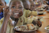 NDAYISABYE John 7 years from Ngwino nawe village is intellectually disabled, having sweet potatoes and beans for lunch. Ngwino Nawe is the village for children with disability working with VSO, an international non-governmental organization working in edu