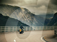 Harley Davidson biker crossing the Kylesku Bridge, Scotland