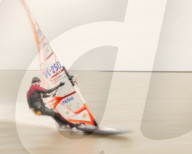 Windsurfer travelling at speed on a grey day at West Kirby Marine Lake