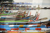 Brightly coloured boats at the U Bein Bridge, Taungthaman Lake, Amarapura near Mandalay, Myanmar (Burma), Asia