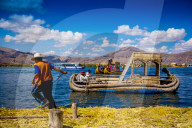 Quechua Indian Family on Floating Grass islands of Uros, Lake Titicaca, Peru