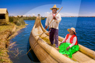 Quechua Indian Couple on Floating Grass islands of Uros, Lake Titicaca, Peru