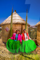 Two Quechua Indian Women on Floating Grass islands of Uros, Lake Titicaca, Peru