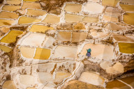 Woman mining Salt, Salineras de Maras, Maras Salt Flats, Sacred Valley, Peru