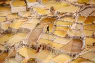 Worker mining for Salt, Salineras de Maras, Maras Salt Flats, Sacred Valley, Peru
