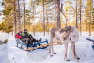Couple on Reindeer Safari, Kakslauttanen Igloo Village, Saariselka, Finland