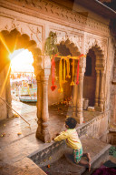 Little Indian boy watching the Traditional Krishna and Radha dance during the Flower Holi Festival, Vrindavan, India
