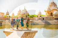 Female Tourists stand in front of Temple during Holi Festival, Vrindavan, India