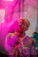 Man throwing colored pigment, Holi Festival, Vrindavan, India