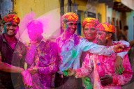 Men throwing colored pigment, Holi Festival, Vrindavan, India