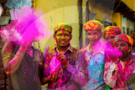 Men throwing colored pigment, Holi Festival, Vrindavan, India