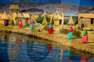 Quechua Indian Family on Floating Grass islands of Uros, Lake Titicaca, Peru