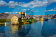 Quechua Indian Family on Floating Grass islands of Uros, Lake Titicaca, Peru