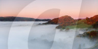 The medieval castle Dinas Bran perched above the cloud inversion lying in the River Dee valley on a clear autumn morning, Denbighshire, Wales, United Kingdom, Europe