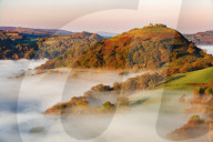 The medieval castle Dinas Bran standing above the mist and fog on an autumn morning, Denbighshire, Wales, United Kingdom, Europe