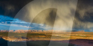 Storm passes across Navajo Mountain just before sunset, Page, Arizona, USA