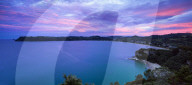 Dusk falls above Cooks Bay on the Pacific Ocean coast of the Coromandel Peninsula, North Island, New Zealand, Pacific