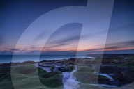 Pointe Du Hoc and its crater filled terrain with dawn breaking over the English Channel, Normandy, France, Europe
