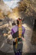 Kalasha woman from Kalasha valley in the north western frontier province of Pakistan wearing traditional dress