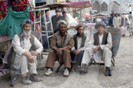 Taking a load off, a quick time out for these hard working Afghans in a bazaar in Kabul, Afghanistan, Asia