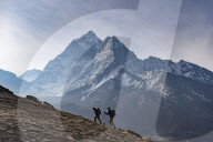 Trekkers climb a small peak above Dingboche in the Everest region in time to see the sunrise, with Ama Dablam in the distance, Himalayas, Nepal, Asia