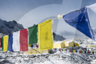 Prayer flags and the Everest base camp at the end of the Khumbu glacier that lies at 5350m, Himalayas, Nepal, Asia