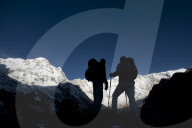 Trekkers on their way down from Annapurna base camp with views of Annapurna 1 in the distance, Himalayas, Nepal, Asia