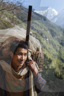A porter makes his daily journey from Lukla to Namche, Himalayas, Nepal, Asia