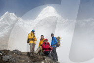 A team of four climbers make their way to Ama Dablam base camp, the 6,856m peak seen here in the distance they will be climbing