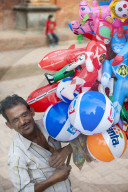 A man selling inflatable toys in Patan - an historical part of Kathmandu in Nepal