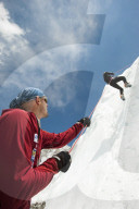 A climber makes her way down an ice wall in preperation for climbing Everest in Nepal