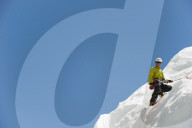 A climber practises on an ice wall in preperation for climbing Everest
