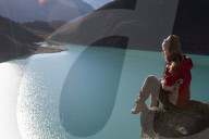 A trekker in the Everest region stops half way up Goyko Ri to enjoy the views